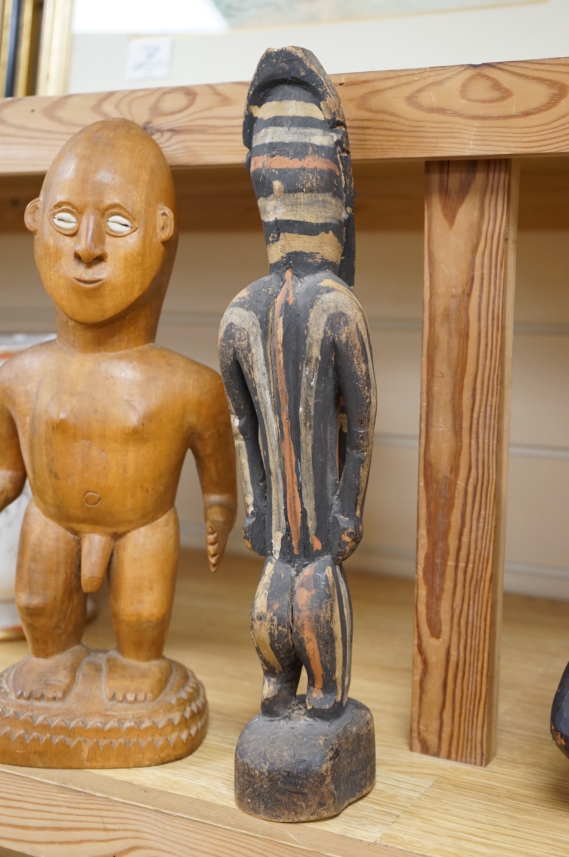 Three wood tribal figures, Africa, South Seas, tallest 37.5cm